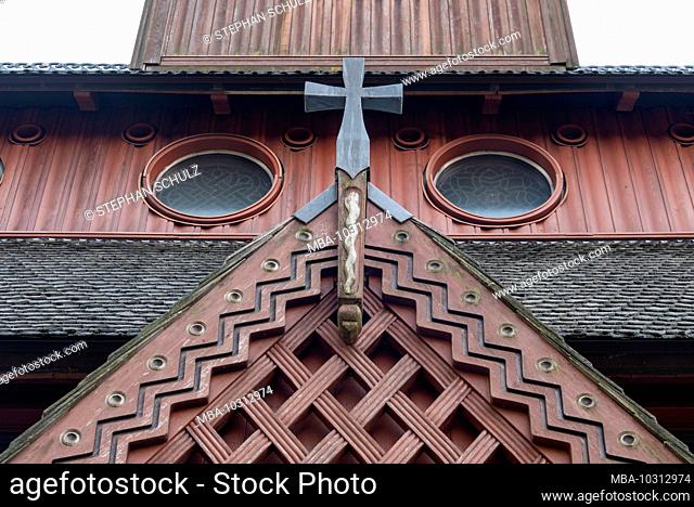 Germany, Lower Saxony, Harz, Goslar, entrance portal with cross of the Gustav Adolf stave church in Hahnenklee, built in 1907 - 1908