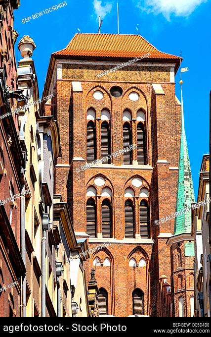 Gdansk, Pomerania / Poland - 2020/07/14: Twin towers of St. Maryâ€™s Basilica - Bazylika Mariacka - seen from Kaletnicza street in the historic old town city...