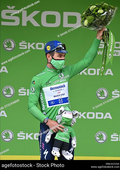 British Mark Cavendish of Deceuninck - Quick-Step celebrates on the podium in the green jersey of leader in the sprint ranking after the seventh stage of the...