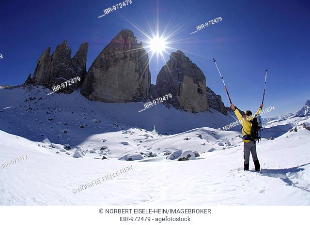 Snowshoeing in front of the mountain Drie Zinnen or Tre Cime di Lavaredo, Italian for Three Peaks of Lavaredo, Hochpustertal Valley or High Puster Valley or...