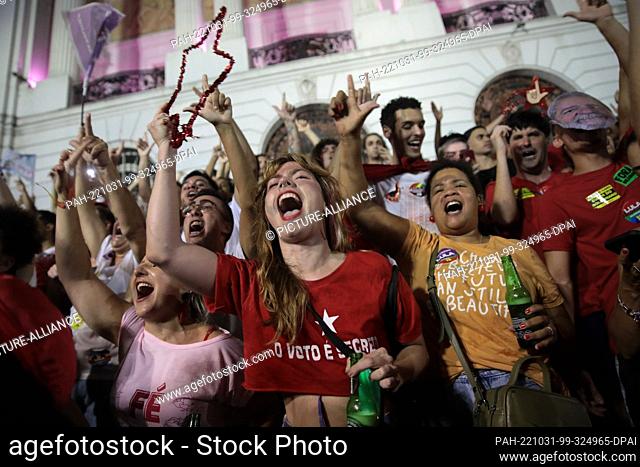30 October 2022, Brazil, Rio de Janeiro: Supporters of former President da Silva celebrate his victory in Brazil's presidential election in downtown Rio de...