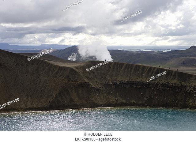 Hikers on Rim of Viti Explosion Crater in Krafla Geothermal Area, Krafla, Nordurland Eystra, Iceland, Europe
