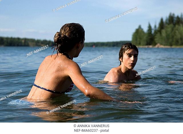 Teenagers bathing in the sea, Sweden