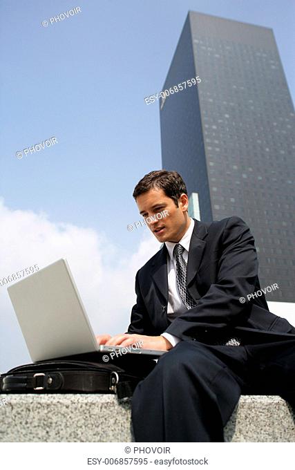 Businessman making use of free public WiFi