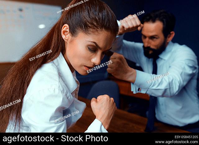 Agressive colleagues dispute while working. Compete in business. Fight of genders concept