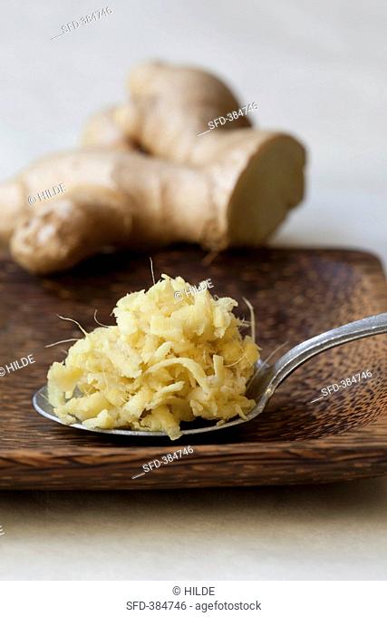 Ginger and a spoon of grated ginger
