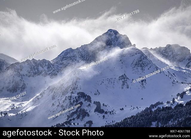 Clouds over the summits of Port de Vielha in winter. The highest peak is the Tuc de Montanèro (Aran Valley, Catalonia, Spain, Pyrenees)