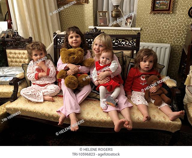 Five Little Girls on Christmas Day with Pyjamas and Teddy Bears