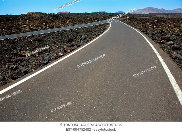 Black volcanic soil and road detail in Lanzarote Canary Island