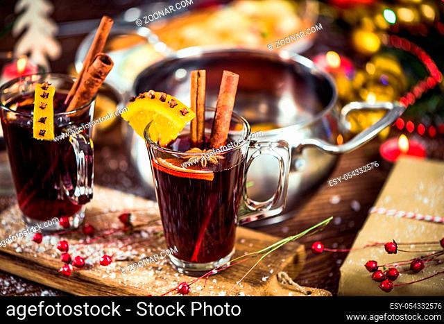 Glass with mulled wine with spices for waming on winter days
