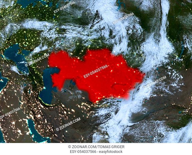 Country of Kazakhstan in red on planet Earth with clouds at night. 3D illustration. Elements of this image furnished by NASA