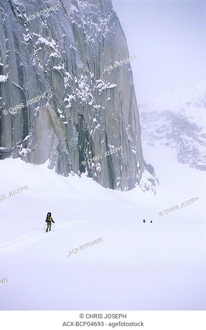 Backcountry skiers under Snowpatch Spire, Bugaboos, British Columbia, Canada