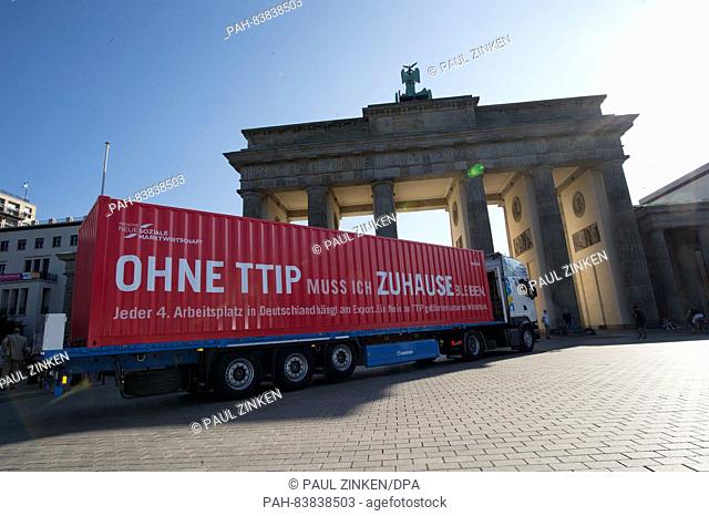 'Without TTIP I have to stay home' can be read on a container in front of the Brandenburg Gate in Berlin,  Germany, 15 September 2016
