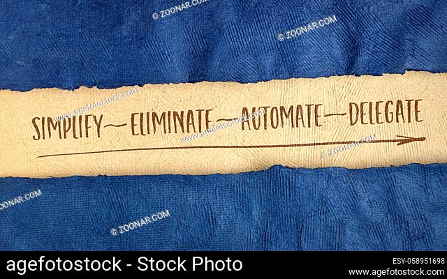 business productivity and lifestyle concept: simplify, eliminate, automate and delegate, handwriting on a handmade bark paper, web banner