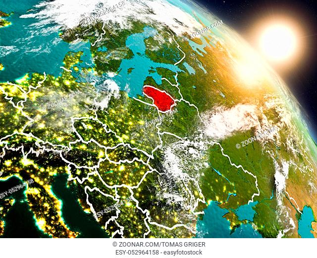 Sunset above Lithuania from space on planet Earth with visible country borders. 3D illustration. Elements of this image furnished by NASA