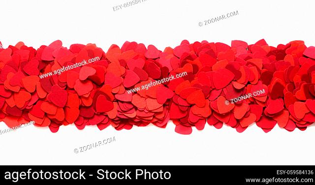 Valentines Day greeting card design element frame of many paper hearts isolated on white background with copy space for text