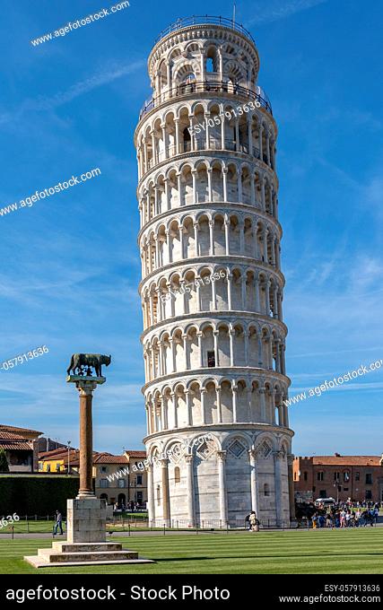 PISA, TUSCANY/ITALY - APRIL 17 : Exterior view of the Leaning Tower of Pisa Tuscany Italy on April 17, 2019. Three unidentified people