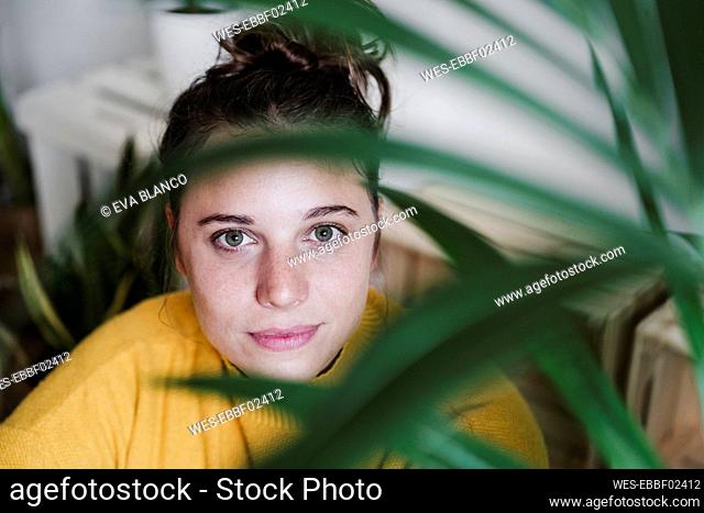Woman staring while sitting at home