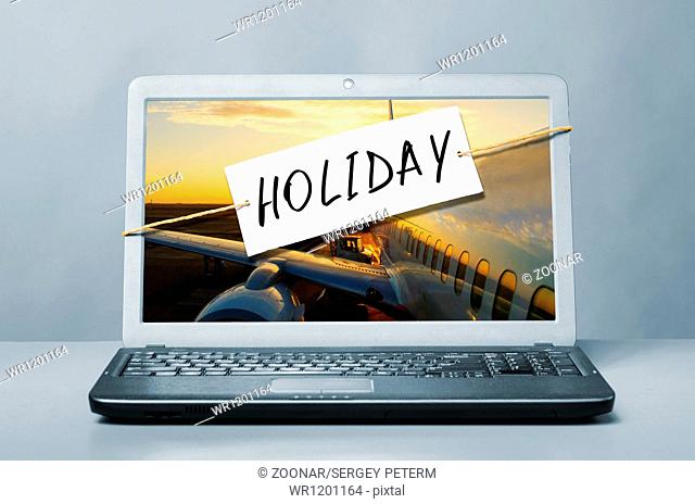 laptop with holiday note