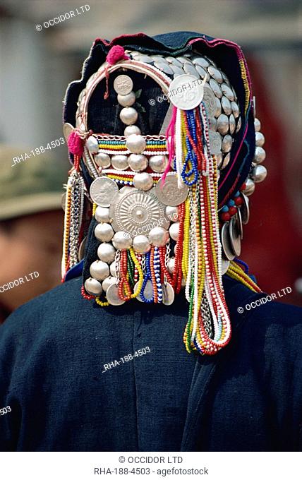Close-up of silver and beads on an Aini Hani hat at Menghai, Yunnan Province, China, Asia