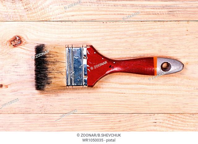 Brush on wooden background