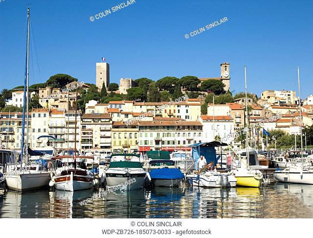 Cannes, harbour, old quarter in background, French Riviera