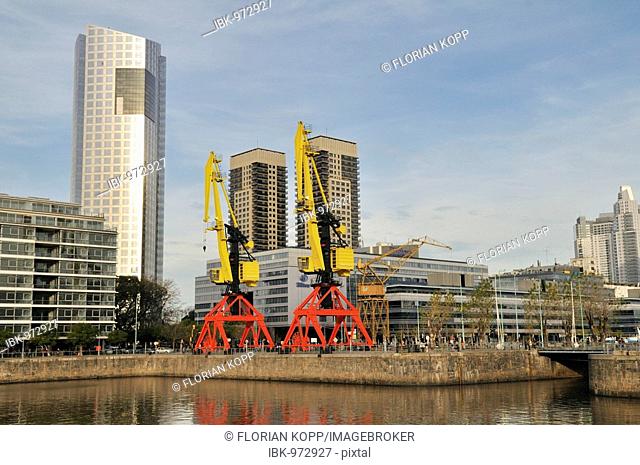 Modern multistorey buildings behind cranes of the old harbour Puerto Madero, Buenos Aires, Argentina, South America
