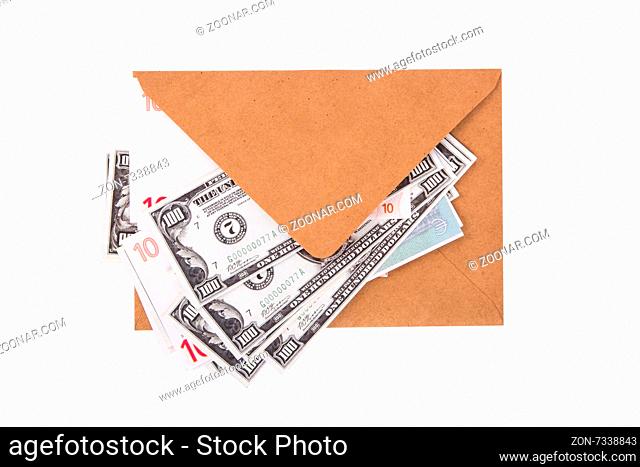 Close up detailed top view of heap of euro and dollar banknotes inside envelope, isolated on white background