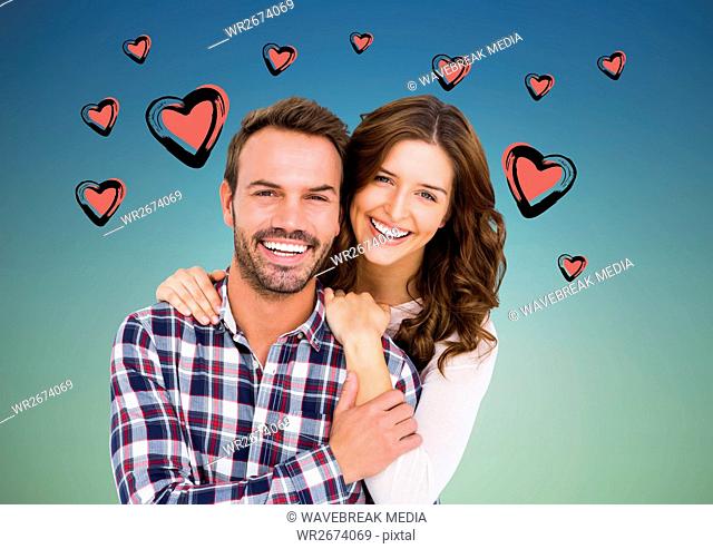 Portrait of couple against hearts background