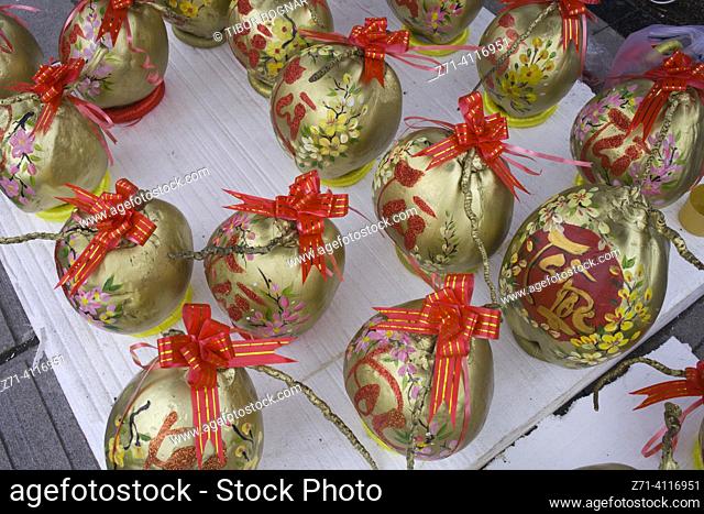 Vietnam, Hue, gift wrapped coconuts,