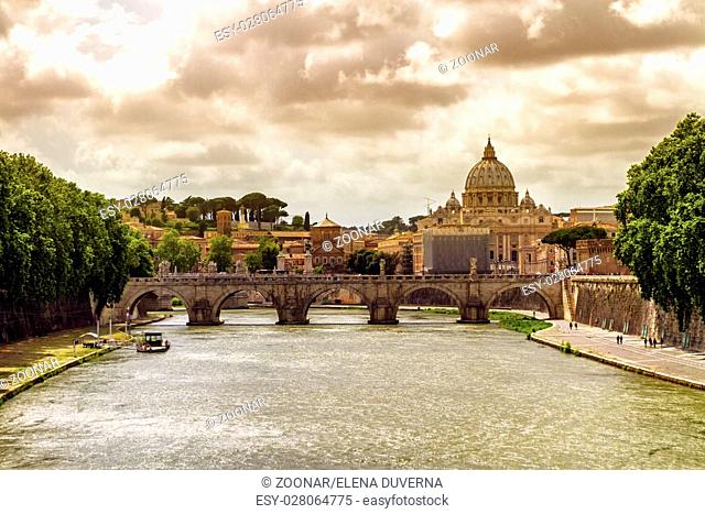 Tiber river, Ponte Sant#39;Angelo and St. Peter#39;s cathedral, Roma, Italy
