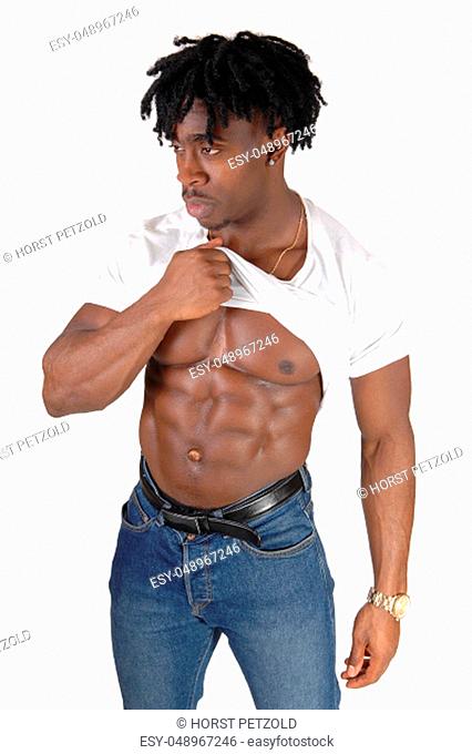 An African American bodybuilder lifting up his shirt and shows his.muscular body, isolated for white background