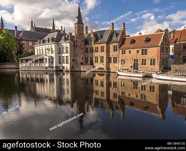 Water reflection of medieval buildings on the water of the Dijver Canal, Bruges, Flanders, Belgium, Europe