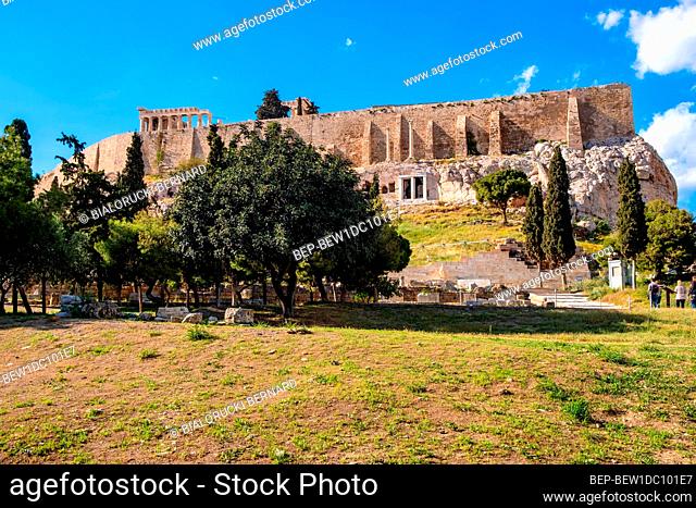 Athens, Attica / Greece - 2018/04/02: Panoramic view of Acropolis hill walls with Parthenon Athena temple seen from Theatre of Dionysos Eleuthereus ancient...