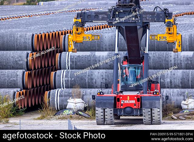 11 September 2020, Mecklenburg-Western Pomerania, Mukran: Pipes for the Nord Stream 2 natural gas pipeline are located in a storage yard in the port of Mukran...