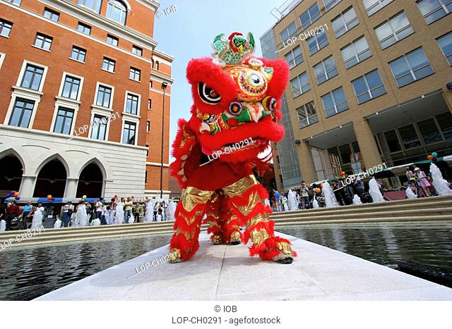 England, West Midlands, Birmingham, Chinese dragon dance in Brindleyplace. Brindleyplace is a large mixed-use canalside development that is named after the 18th...