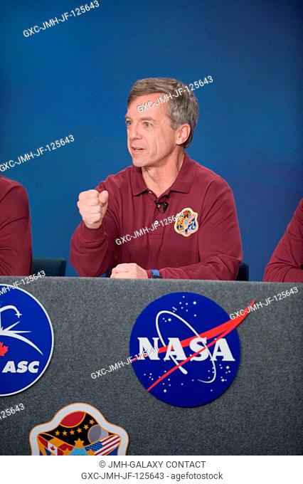 Canadian Space Agency astronaut Robert Thirsk, Expedition 2021 flight engineer, responds to a question from a reporter during an Expedition 2021 preflight press...
