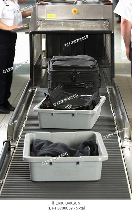 Airport security worker checking baggage