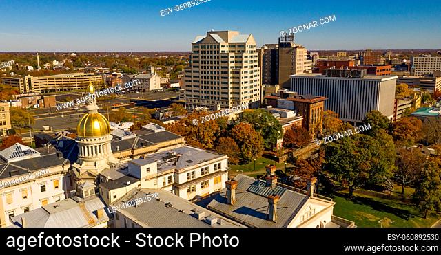 The state capital dome reflects sunlight late afternoon in downtown Trenton New Jersey