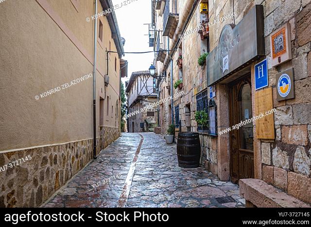 Narrow street with Asador El Panadero restaurant in Sepulveda town in Province of Segovia, Castile and Leon autonomous community in Spain