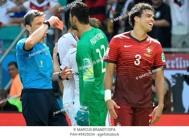 Pepe of Portugal (R) receives the Red card by referee Milorad Mazic of Serbia during to the FIFA World Cup 2014 group G preliminary round match between Germany...