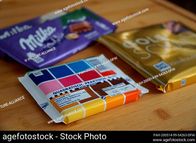 ILLUSTRATION - 14 May 2020, Berlin: Chocolate bars of the brands Ritter Sport and Milka are placed on a table. (scene posed) (to dpa ""Milka disputes Ritter...