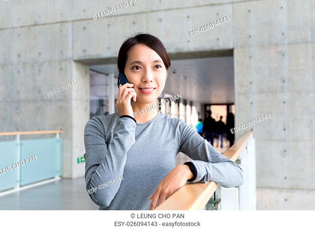 Young woman talk to mobile phone
