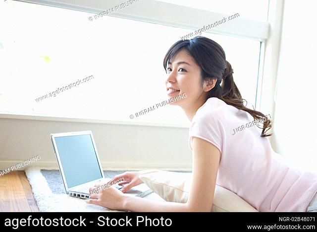 Asian woman using a laptop