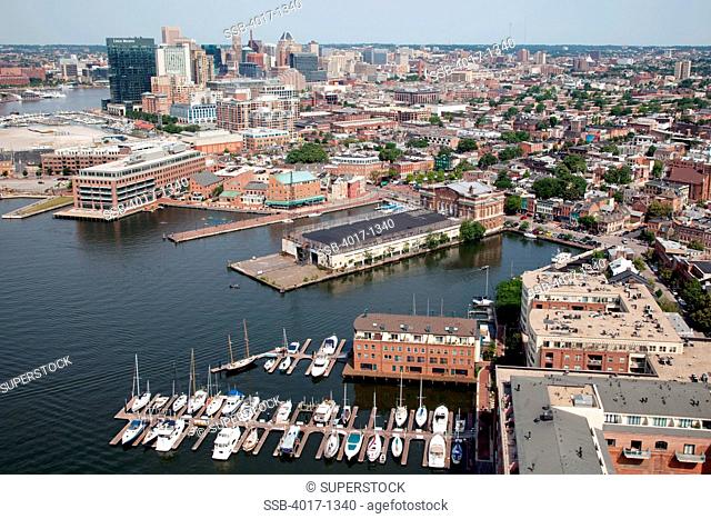 Aerial of Fells Point near the Inner Harbor of Baltimore, Maryland with the downtown skyline in background