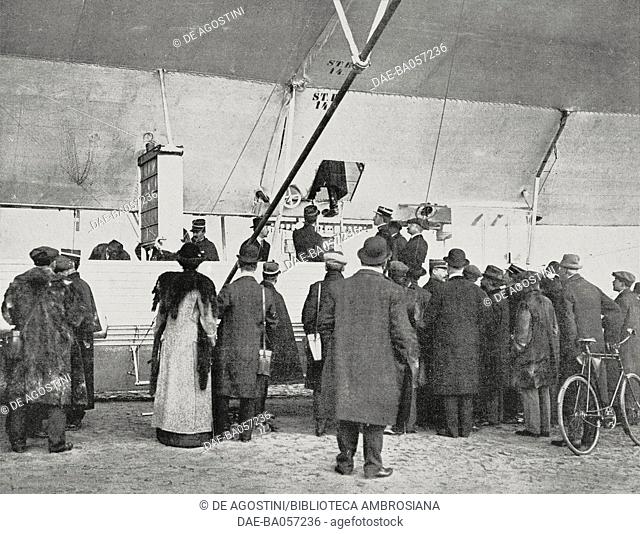 Some French air force officers watch a Zeppelin airship, Luneville, France, photograph from the magazine L'Illustration, year 71, no 3659, April 12, 1913