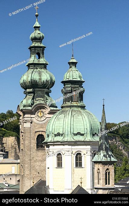 Austria, Salzburg. Church spires, including St Peter's Abbey