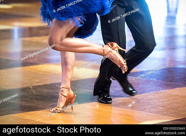 Legs of young dancers on the dance floor