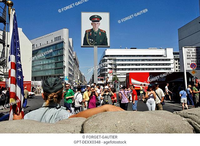 CHECKPOINT CHARLIE, ON THE FRIEDRICH STRASSE, THE FAMOUS CROSSING POINT BETWEEN THE AMERICAN AND THE SOVIET SECTORS. IT WAS, IN EFFECT