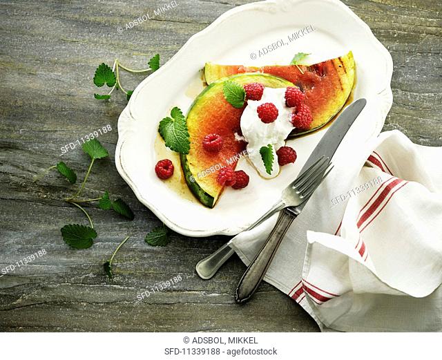 Grilled watermelon with cream cheese and raspberries